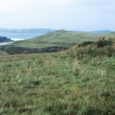 Looking towards the end of the headland. On the right is the first of two Bronze Age barrows.